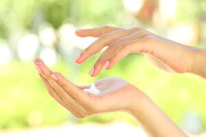 Drop of hand cream on female's hand